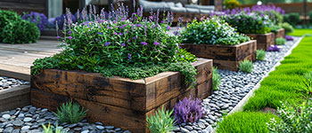 railway sleepers raised garden beds with lavender next to house patio thumbnail image