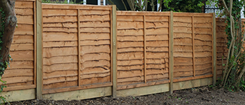 Overlap Fence Panels with Gravel Boards