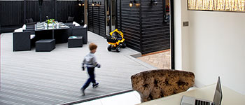 Toddler walking across composite decking