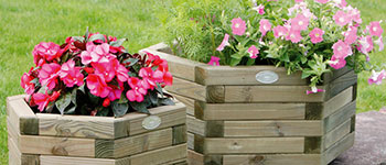 Wooden hexagon shaped Planters with flowers in bloom