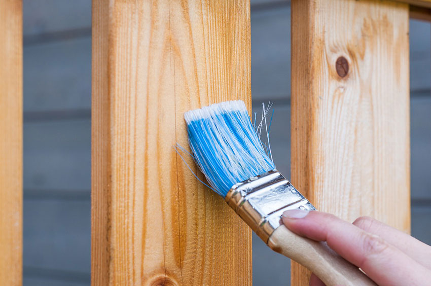 Applying wood protection with a brush
