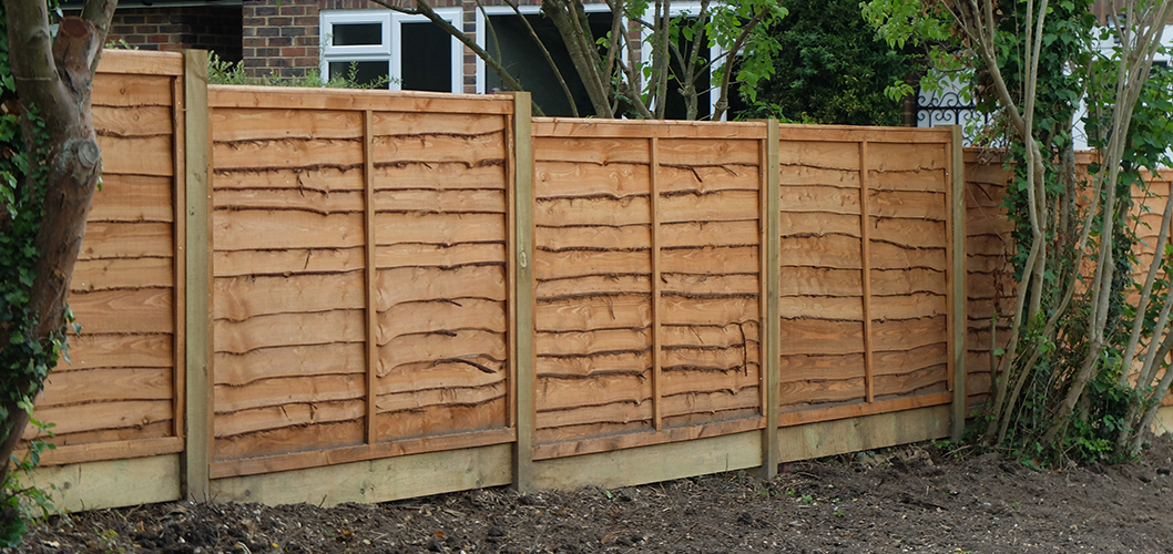 Overlap Fence Panels with Gravel Boards