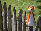 Chestnut pailing with a ornamental fox on one of the pailings