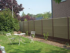 2 chairs and a table next to a ECO PVC flat top fence