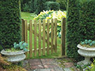 A Palisade gate with two planters