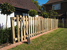 A Picket Palisade fence being installed