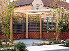 A Corner Pergola set in a Garden